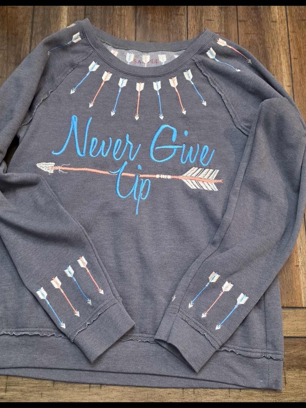 Never Give Up Arrow Crewneck Sweatshirt "Sample"